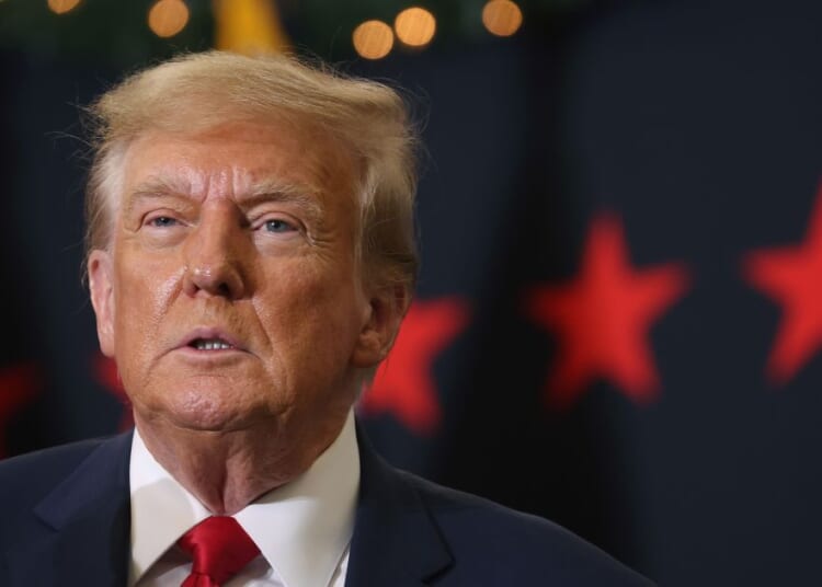 Former President Donald Trump looks on during a campaign event on Tuesday in Waterloo, Iowa.