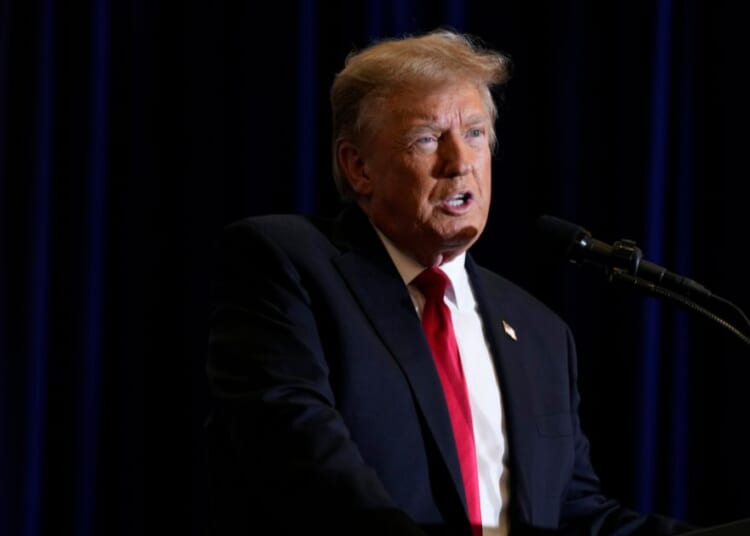 Donald Trump speaking during a commit to caucus rally in Iowa