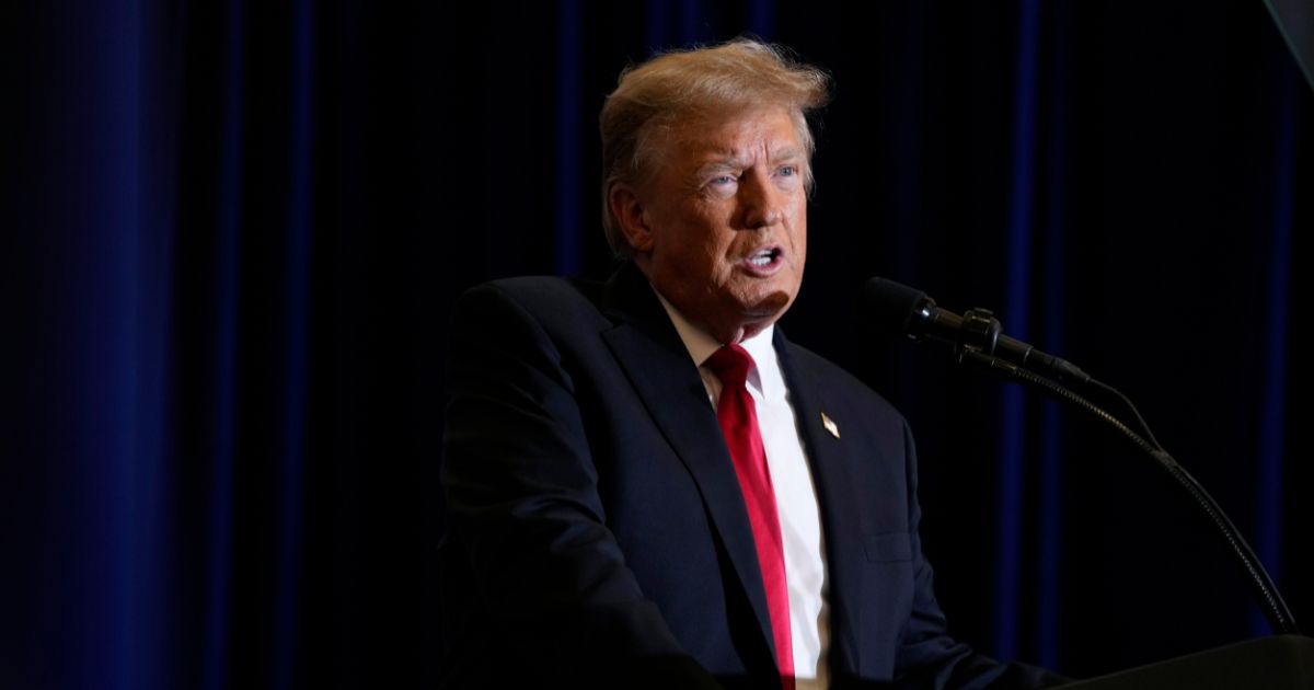 Donald Trump speaking during a commit to caucus rally in Iowa