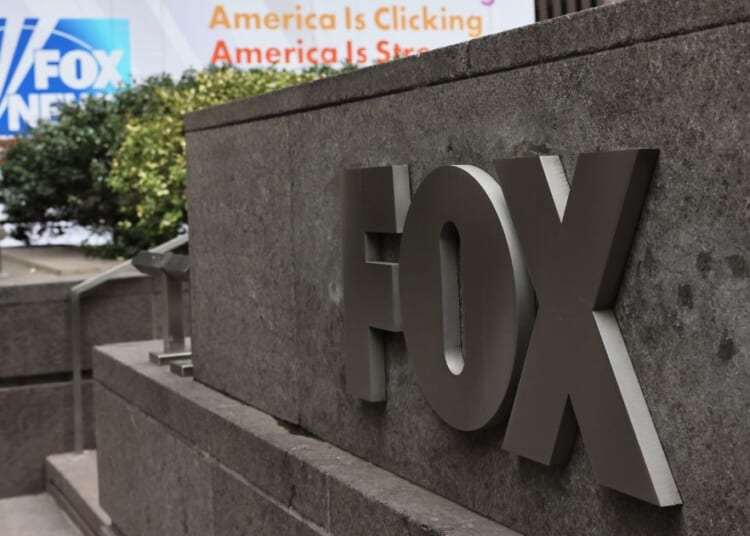 The Fox logo is displayed outside the News Corp Building in New York City.