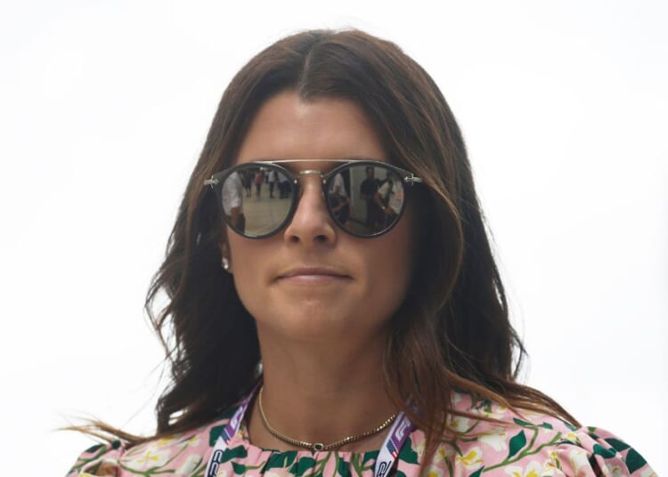 Danica Patrick walks in the Paddock prior to the F1 Grand Prix of Miami at the Miami International Autodrome on May 8, 2022 in Miami, Florida.