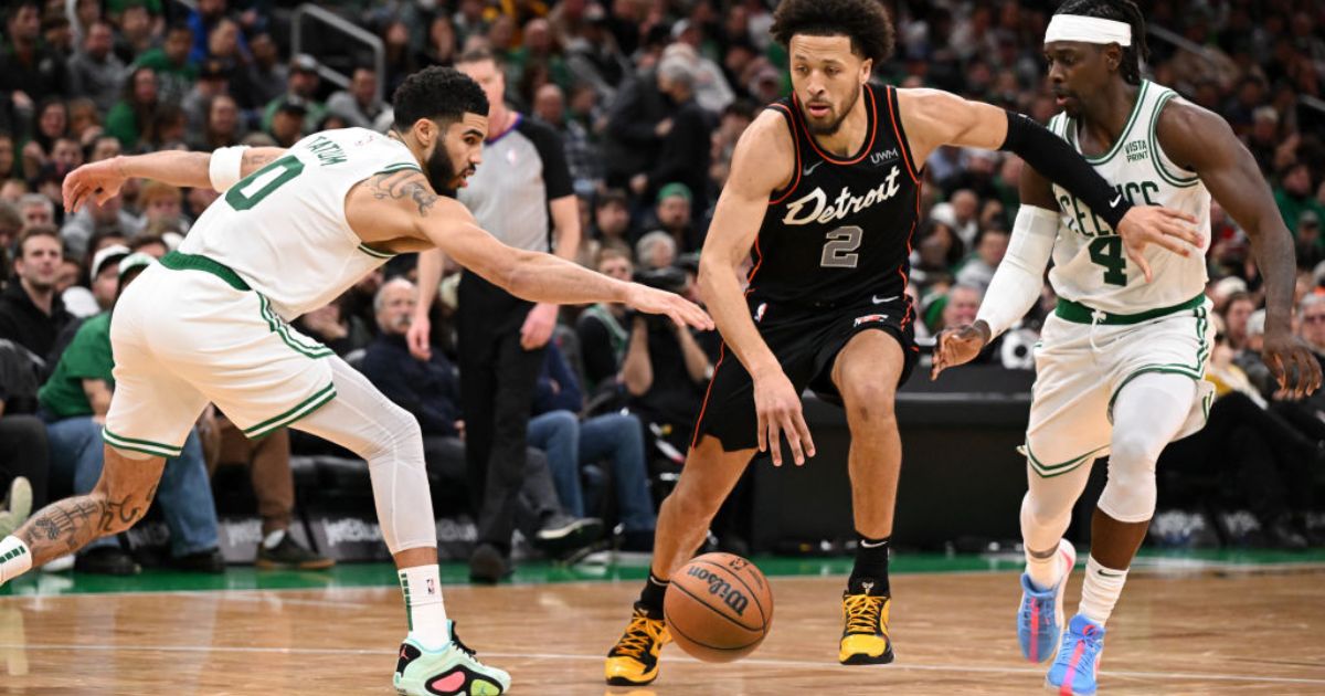 Cade Cunningham, #2 of the Detroit Pistons, drives to the basket against Jayson Tatum #0 and Jrue Holiday #4 of the Boston Celtics during the fourth quarter at Boston's TD Garden on Thursday.