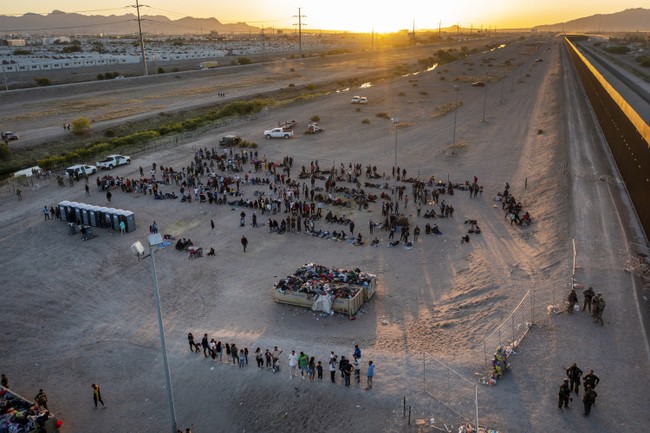 Immigrants Push Past Guards and Rush the Border Fence – HotAir